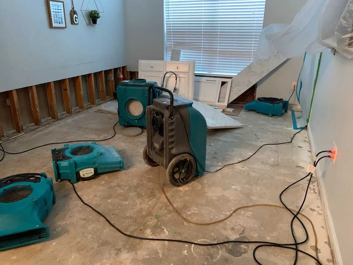 Dehumidifier in flood-cut room for Water Damage Restoration in Lenoir